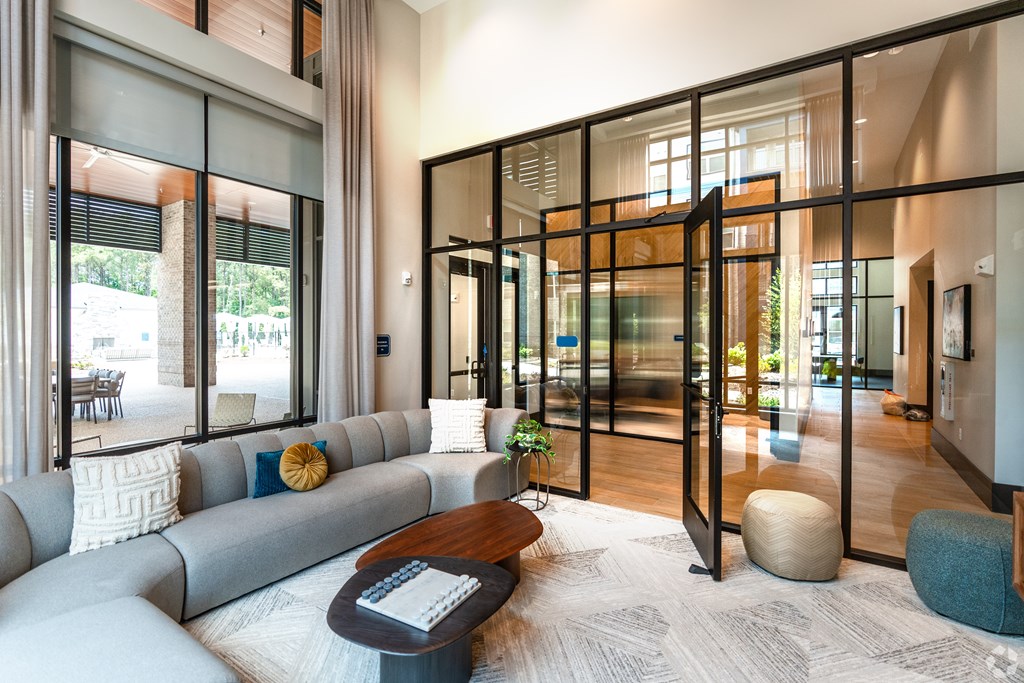 a living room with a gray couch and a coffee table at Preston Ridge, Cary, NC